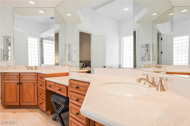 bathroom featuring ornamental molding, vanity, tile patterned flooring, and a wealth of natural light