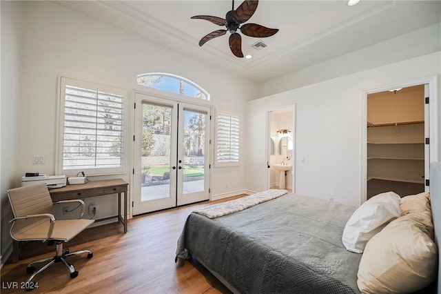 bedroom featuring french doors, a walk in closet, a closet, ceiling fan, and access to exterior