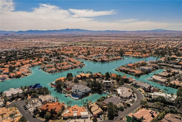 aerial view featuring a water and mountain view