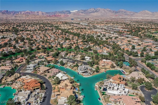 bird's eye view featuring a water and mountain view