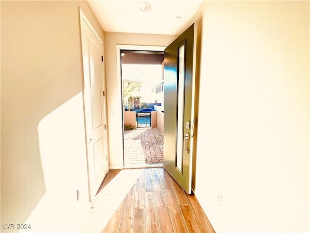 hall with light wood-type flooring