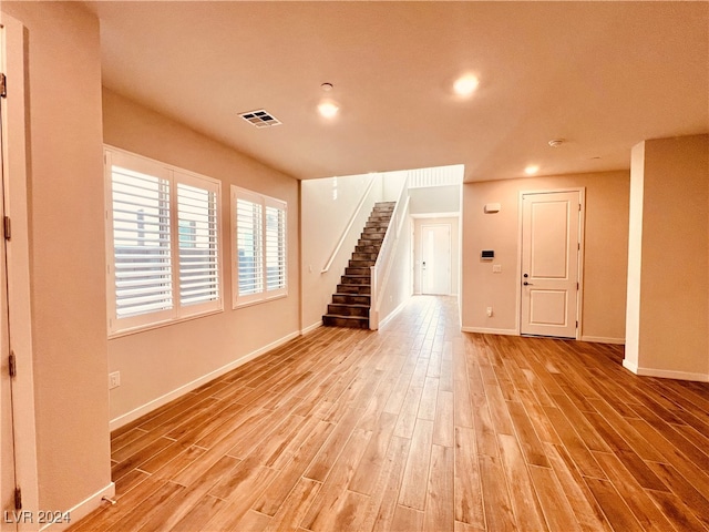 unfurnished living room with light wood-type flooring