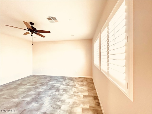 empty room featuring ceiling fan