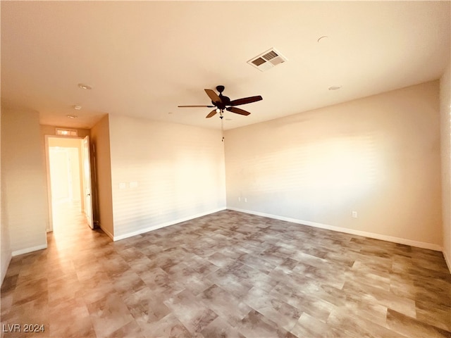 unfurnished room with ceiling fan