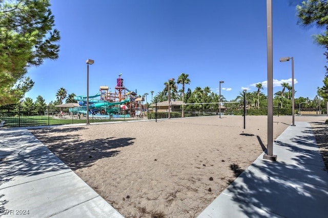 view of home's community with volleyball court and a playground