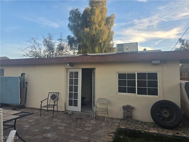 back of house with a patio and central AC