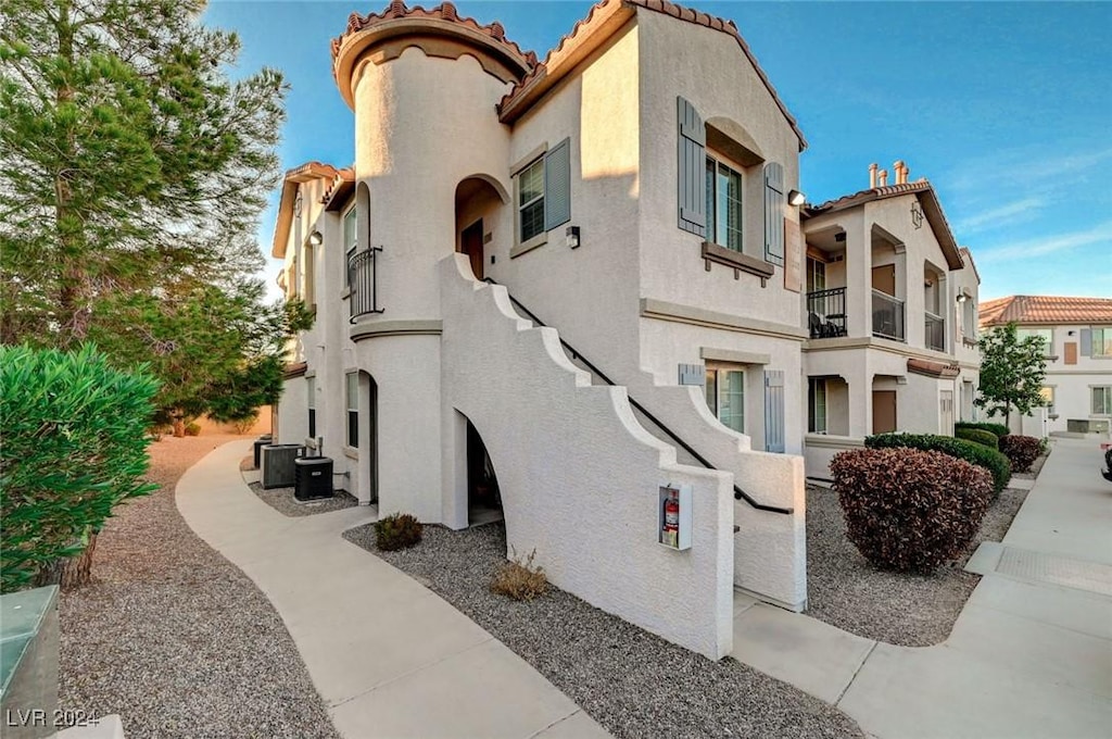 view of property featuring central AC unit