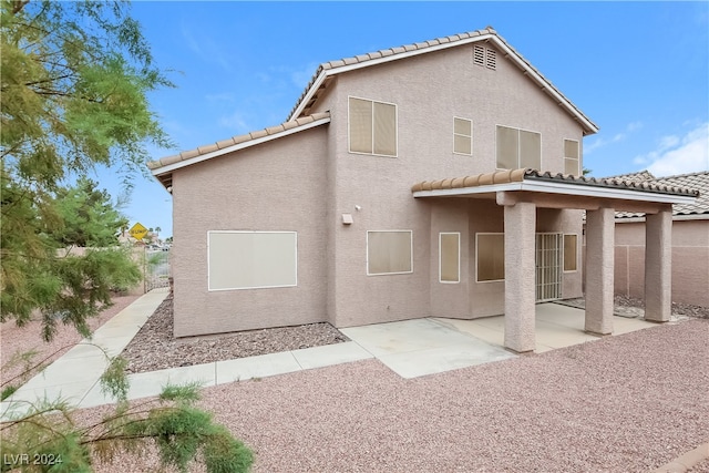 rear view of house featuring a patio area