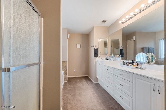 bathroom with vanity and independent shower and bath