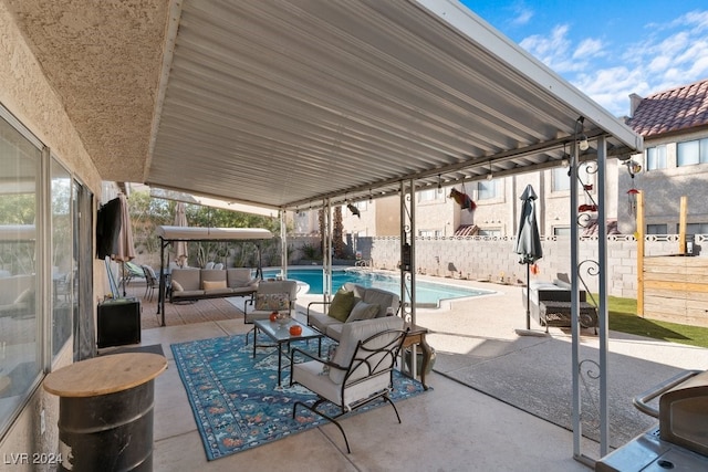 view of patio / terrace with a fenced in pool