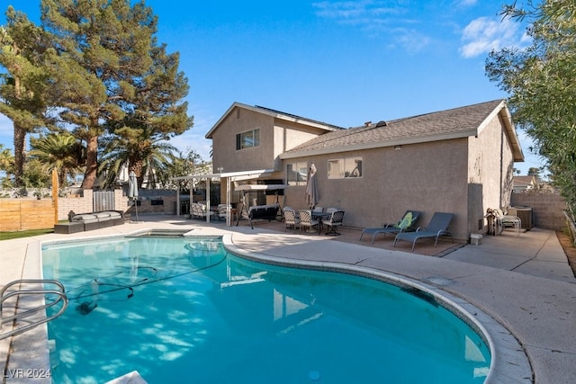 view of swimming pool with a patio area