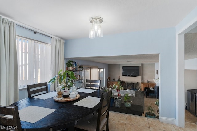 dining space with light tile patterned floors