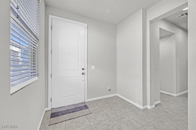 entryway featuring light tile patterned floors