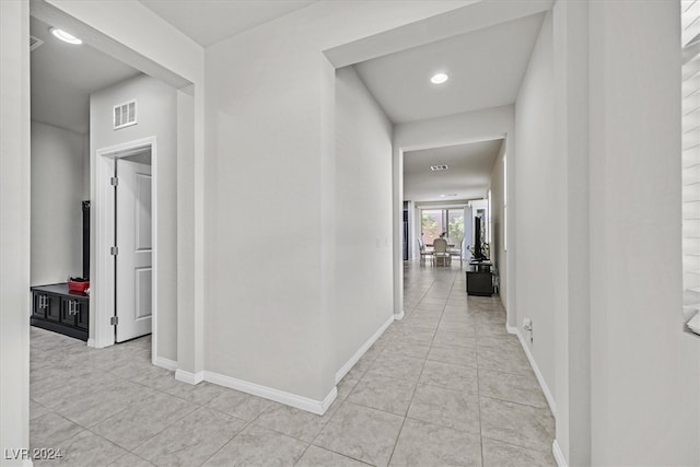 hallway with light tile patterned floors