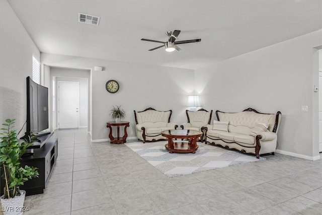 tiled living room featuring ceiling fan