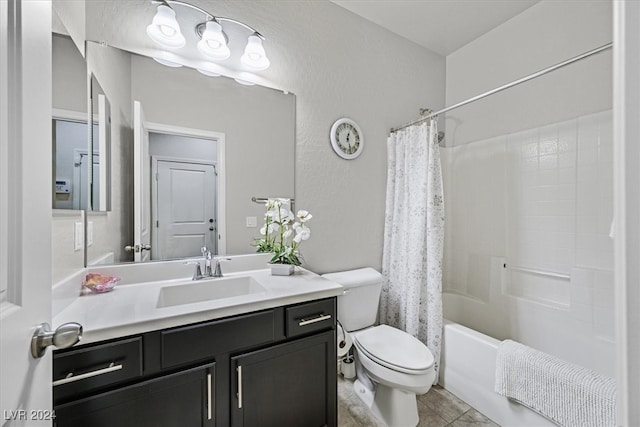 full bathroom featuring tile patterned flooring, vanity, toilet, and shower / tub combo with curtain