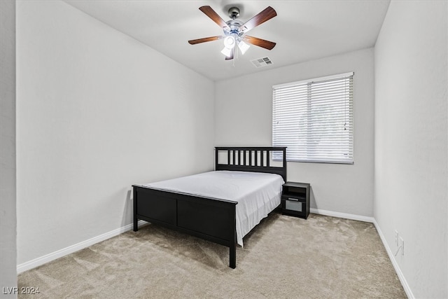 carpeted bedroom with ceiling fan