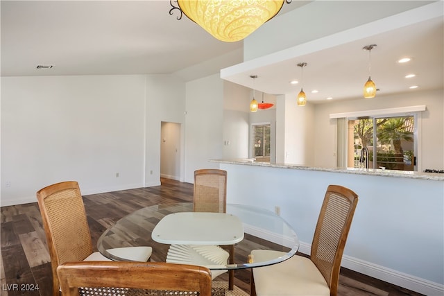 dining space with dark hardwood / wood-style floors