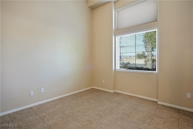 empty room with light tile patterned flooring