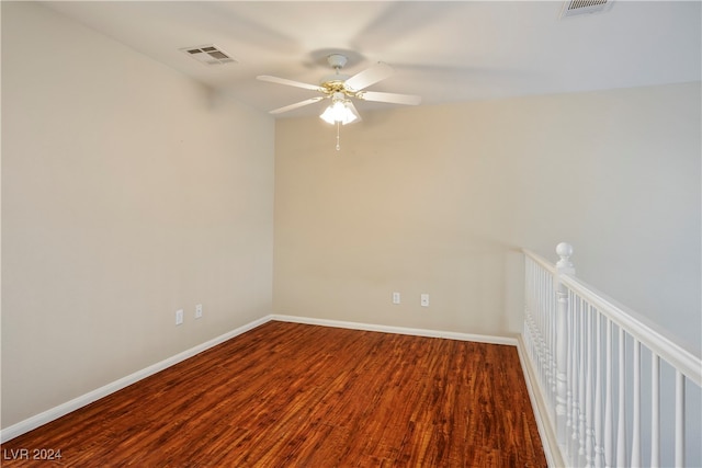 spare room with ceiling fan and wood-type flooring