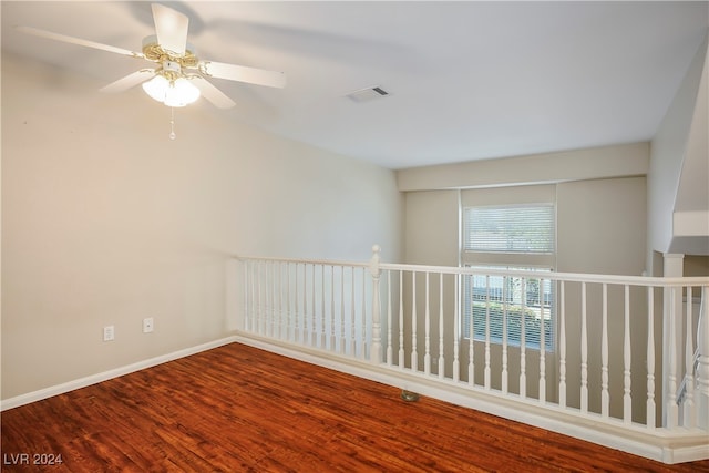 spare room with hardwood / wood-style floors and ceiling fan