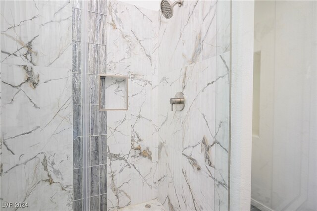 interior space featuring a tile shower