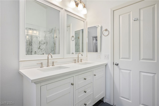 bathroom with a shower and vanity