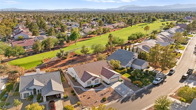 birds eye view of property with a mountain view