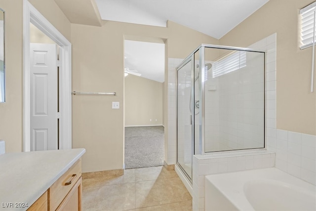 bathroom with vanity, ceiling fan, plus walk in shower, tile patterned flooring, and lofted ceiling