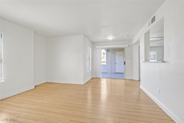 foyer featuring a wealth of natural light and light hardwood / wood-style flooring