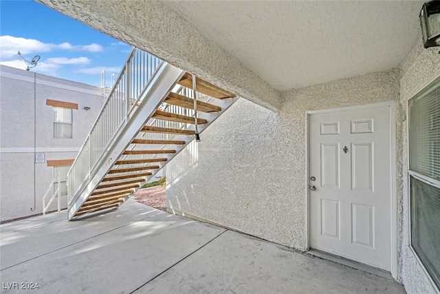 entrance to property with a patio area