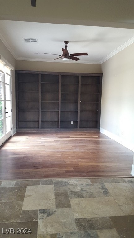 spare room featuring hardwood / wood-style flooring, ceiling fan, and crown molding