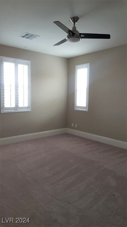 carpeted empty room with ceiling fan