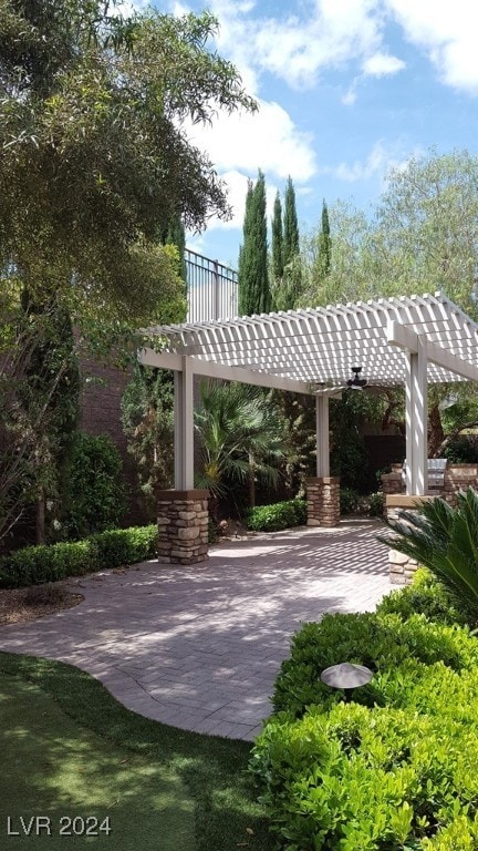 view of property's community featuring a patio and a pergola