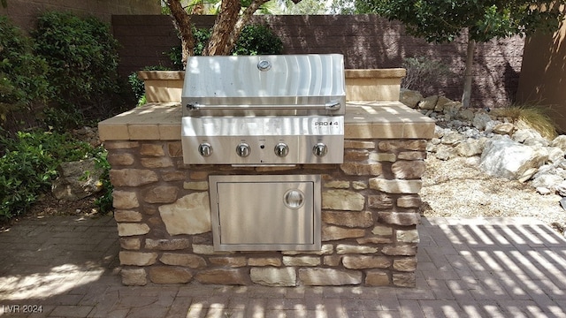 exterior space featuring a grill