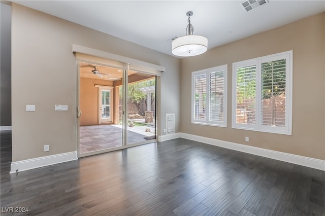 2804 Josephine Dr, Henderson, NV 89044 - empty room with plenty of natural light, baseboards, and dark wood-type flooring