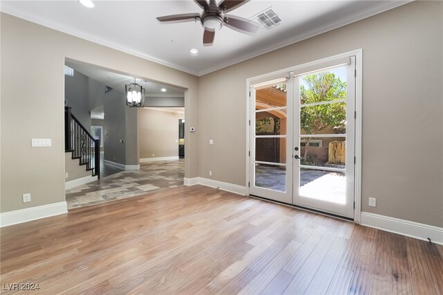 2804 Josephine Dr, Henderson, NV 89044 - doorway to outside featuring ornamental molding, light wood-style flooring, ceiling fan, stairway, and baseboards