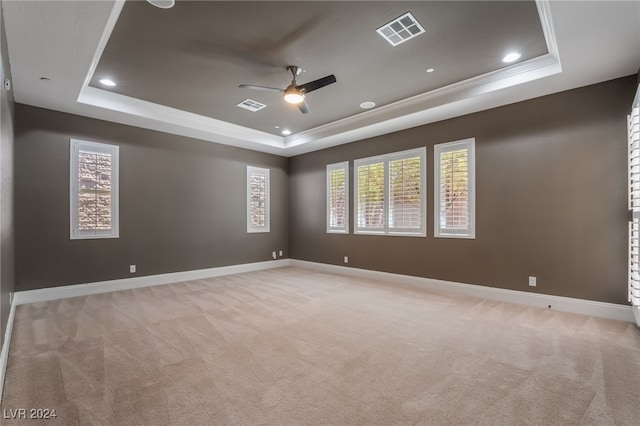 2804 Josephine Dr, Henderson, NV 89044 - empty room with a raised ceiling, light carpet, ceiling fan, healthy amount of natural light, and recessed lighting