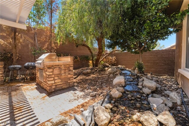 2804 Josephine Dr, Henderson, NV 89044 - fenced backyard with a patio area