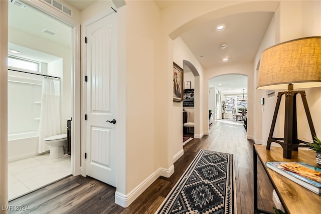 hall with dark wood-type flooring