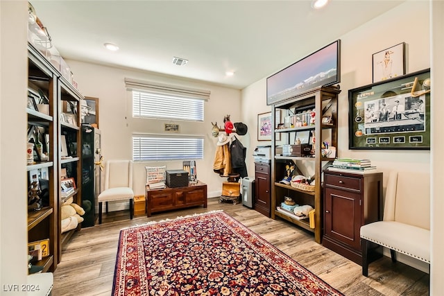 sitting room featuring light hardwood / wood-style flooring