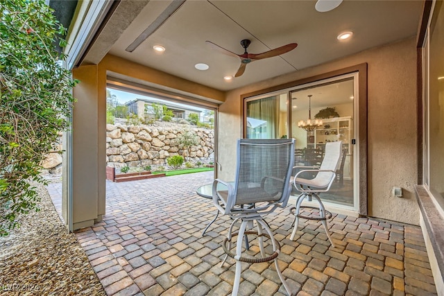 view of patio featuring ceiling fan