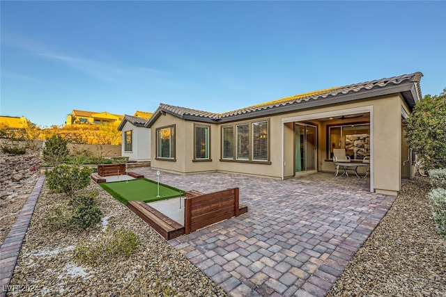 back of house featuring a patio area