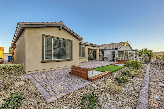 rear view of property with a patio area