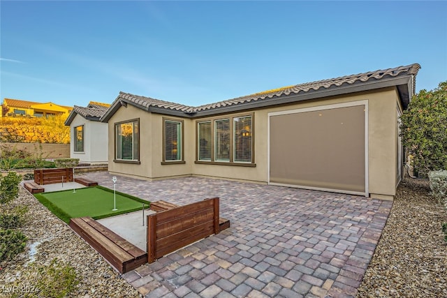 rear view of house with a patio area