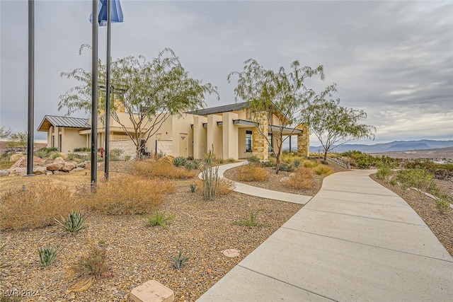 view of front of home with a mountain view