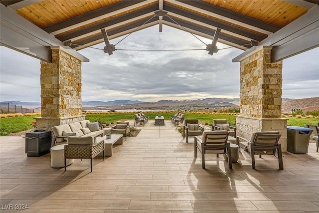 view of patio featuring outdoor lounge area, a mountain view, and a gazebo