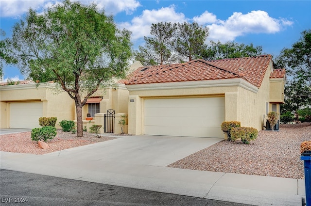 mediterranean / spanish-style house featuring a garage