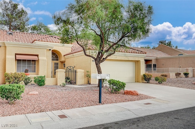 mediterranean / spanish-style home featuring a garage