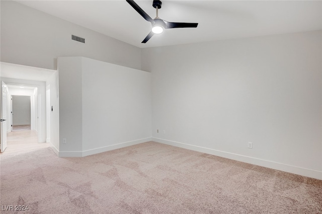 carpeted empty room featuring ceiling fan